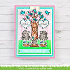 Card with cartoon moles and tree, featuring text 'You're my soul mate' and 'I like you a mole lot!' on a wooden background.
