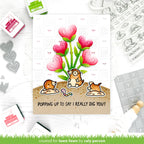 Valentine's Day card with cartoon moles and heart-shaped flowers, surrounded by stamping tools.