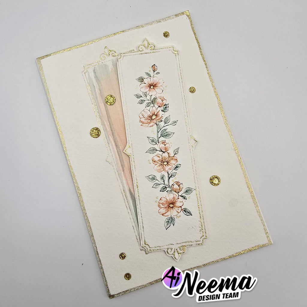 A handmade layered card featuring a cream embossed background, a central vertical panel with peach flowers and green leaves, a soft blush feather, and small gold foil dots