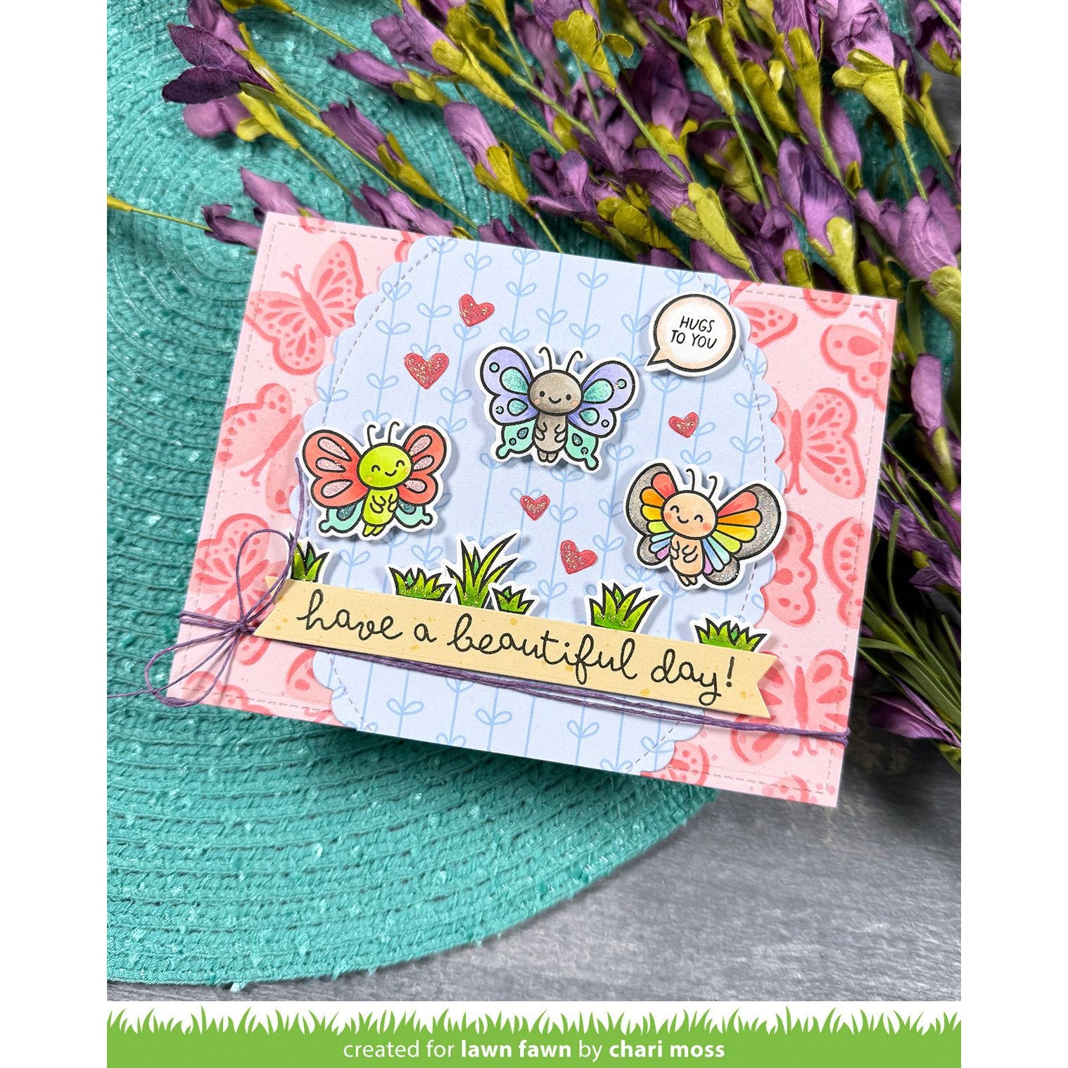 Card with butterfly designs and text 'have a beautiful day!' on a floral background