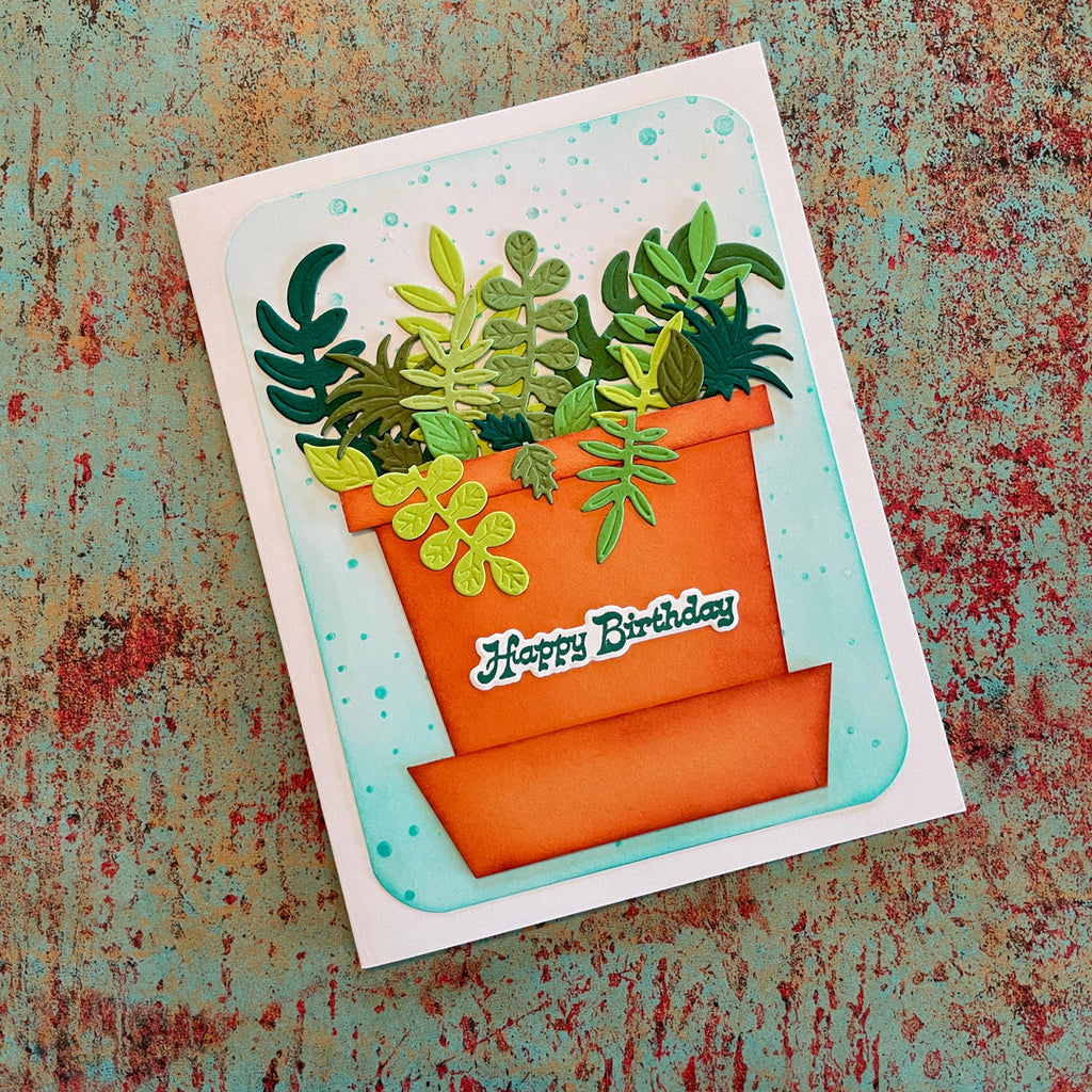 Greeting card with an orange pot of green plants and 'Happy Birthday' text on a textured background.