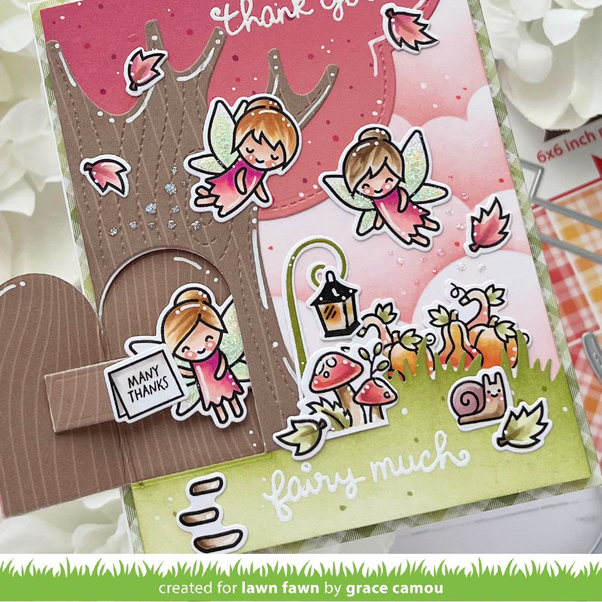 Card with fairy-themed design and 'thank you' message, featuring cartoon fairies and decorative elements.