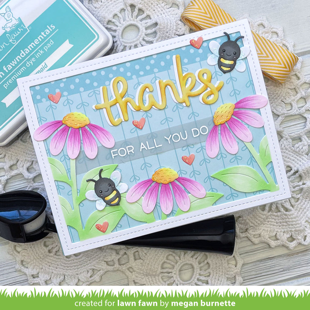 Colorful card with flowers and bees on a textured surface
