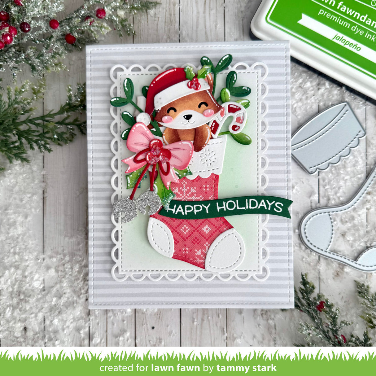 Christmas-themed card with a fox in a stocking and 'Happy Holidays' text, surrounded by festive decorations.