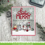 Christmas card with 'Merry' and cat illustrations on a wooden surface with decorative elements.