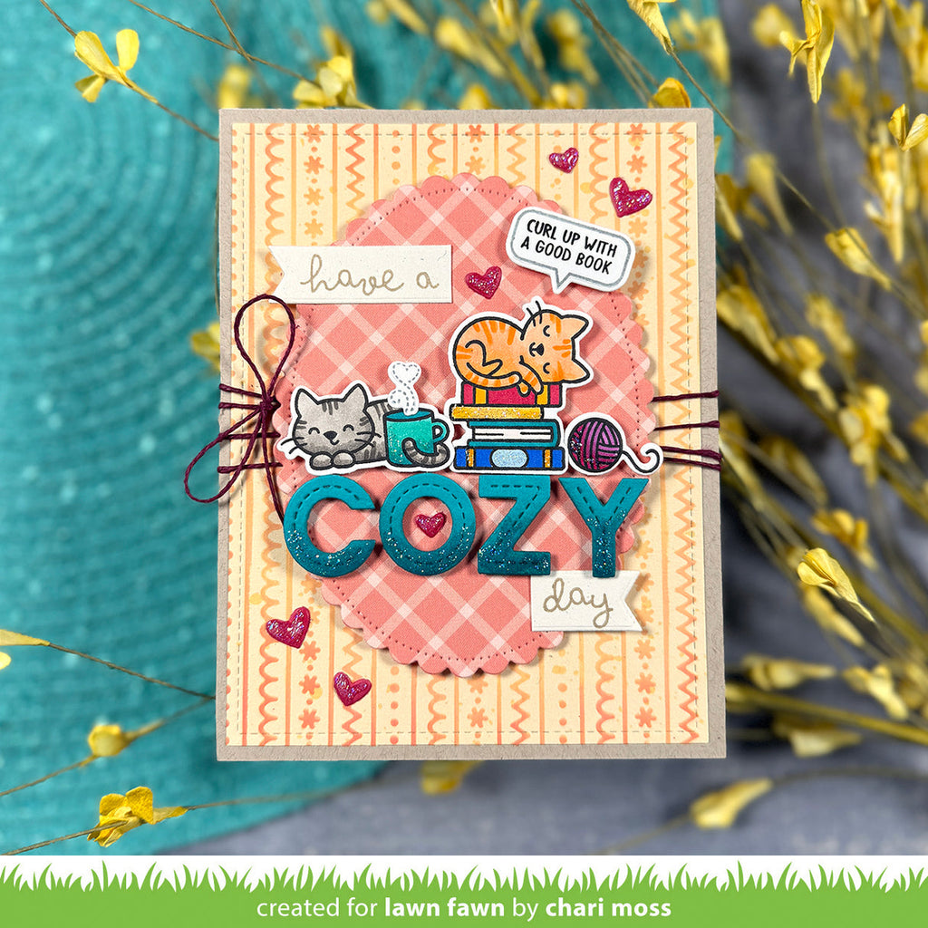 Decorative card with cat illustrations and text 'have a cozy day' on a textured background.