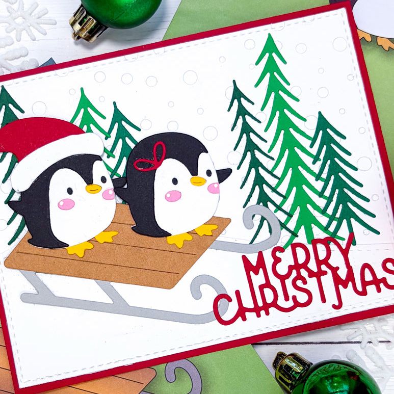 Poppy Stamps Winter Sled Dies 2799 penguins on sled trees christmas card