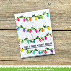 Greeting card with colorful Christmas lights design on a wooden surface