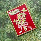Christmas card with holly design and 'Mistletoe' text on a green leaf background
